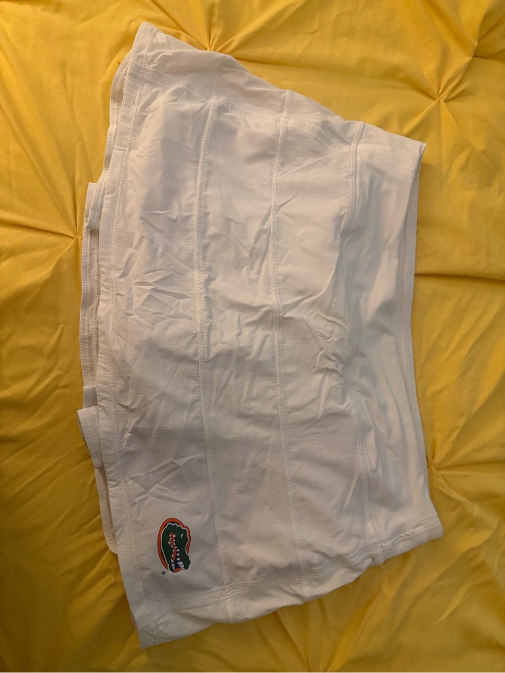 lululemon athletica white skirt with green and orange logo